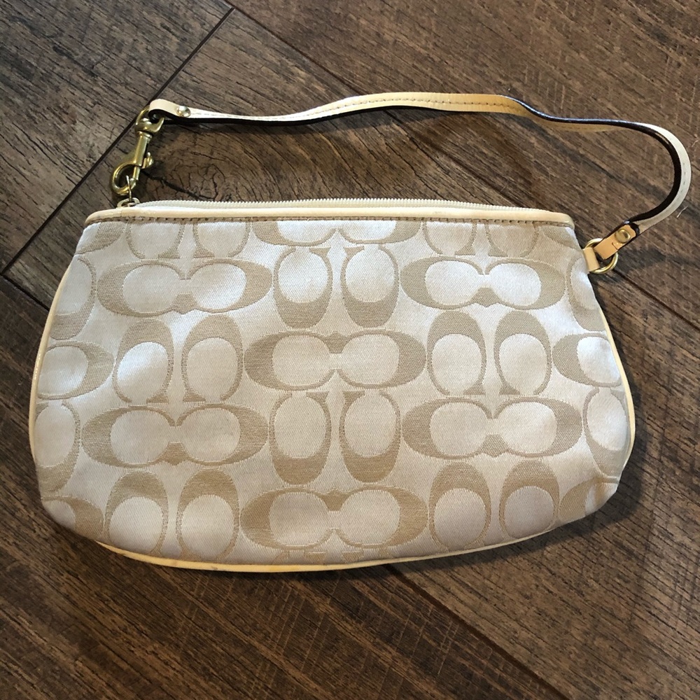 Cream and gold coach wristlet